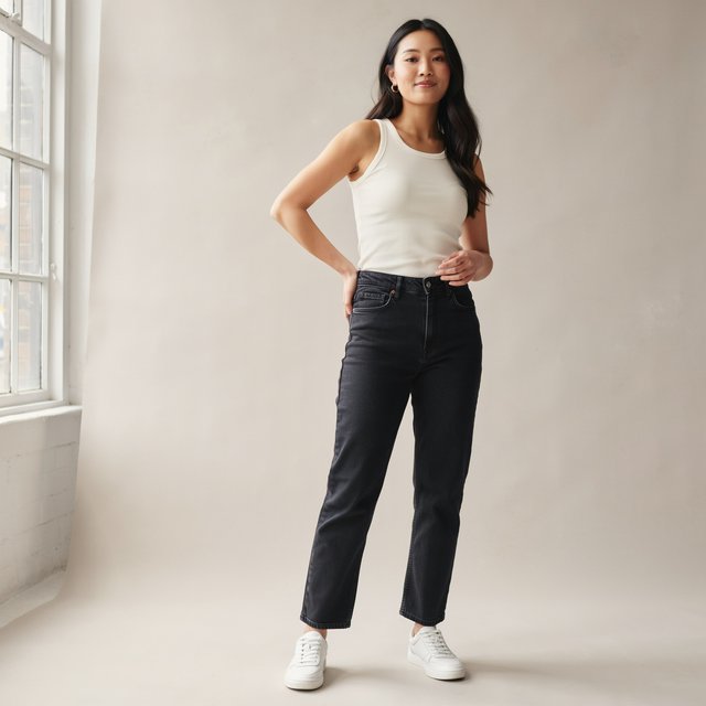 A pretty mixed-race woman of Korean, White, and Black heritage, curvy, full-body image, plain background. — Ideogram v4
