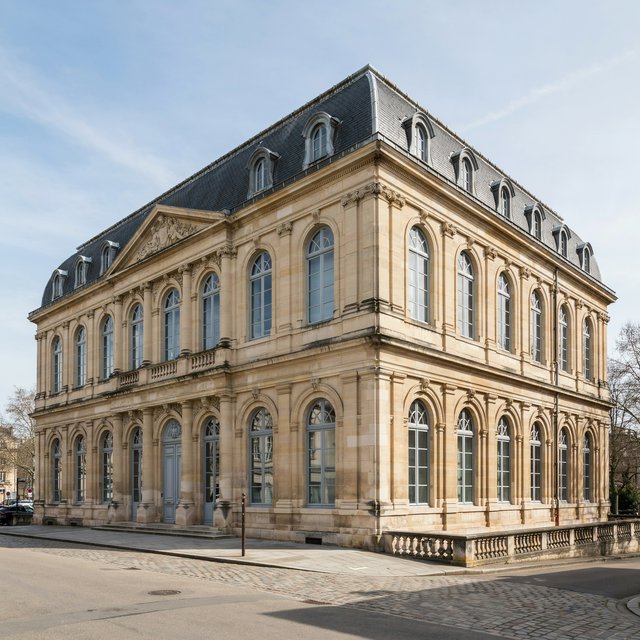 Exterior of a French Second Empire town hall with pale limestone, a dark mansard roof, copper cresting, and tall arched windows; clear spring light falls across the entrance terrace, viewed from the quiet street corner, precise lines and believable construction. — Ideogram v4.5