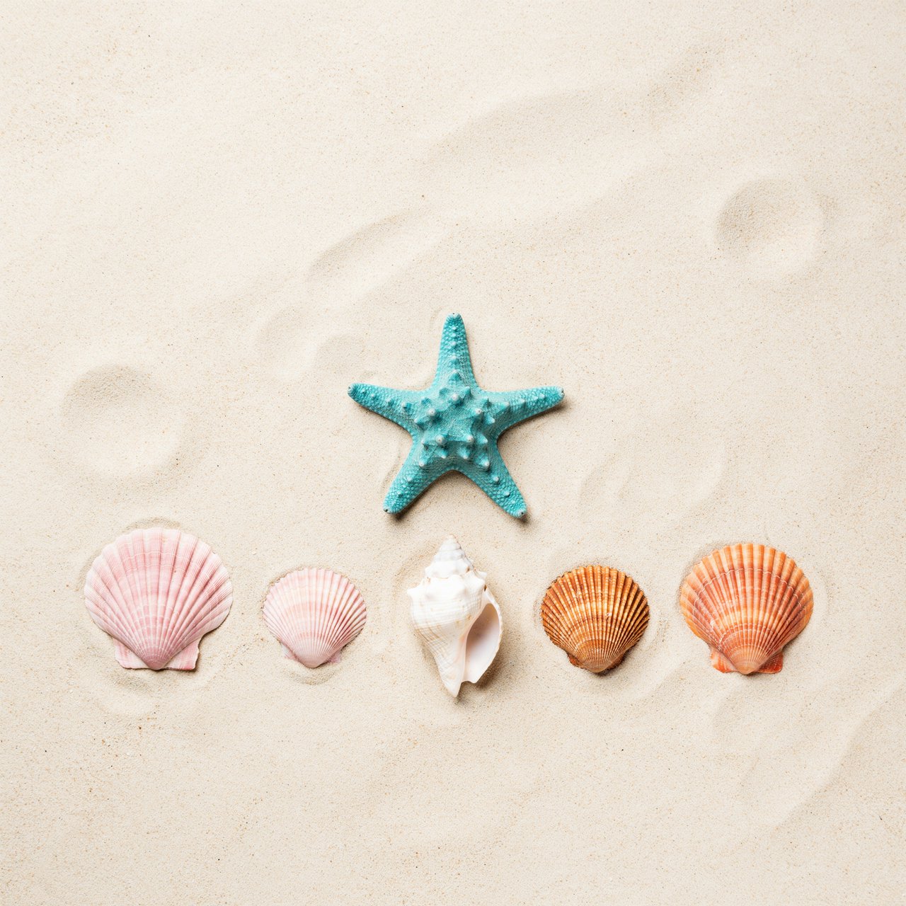Exactly five seashells lie on pale sand: two pink shells on the left, one white shell in the center, and two orange shells on the right. A turquoise starfish sits above the center shell, nothing else. — Ideogram v4
