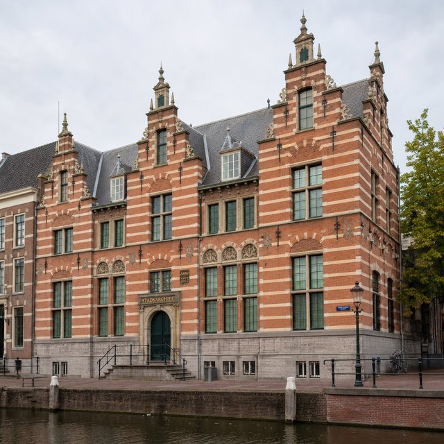 Exterior of a Dutch Renaissance canal-side archive, with warm red brick, pale stone bands, stepped gables, and tall sash windows; soft overcast light reveals the masonry, viewed from the opposite quay, with convincing structure and precise architectural lines. — GPT Image 2
