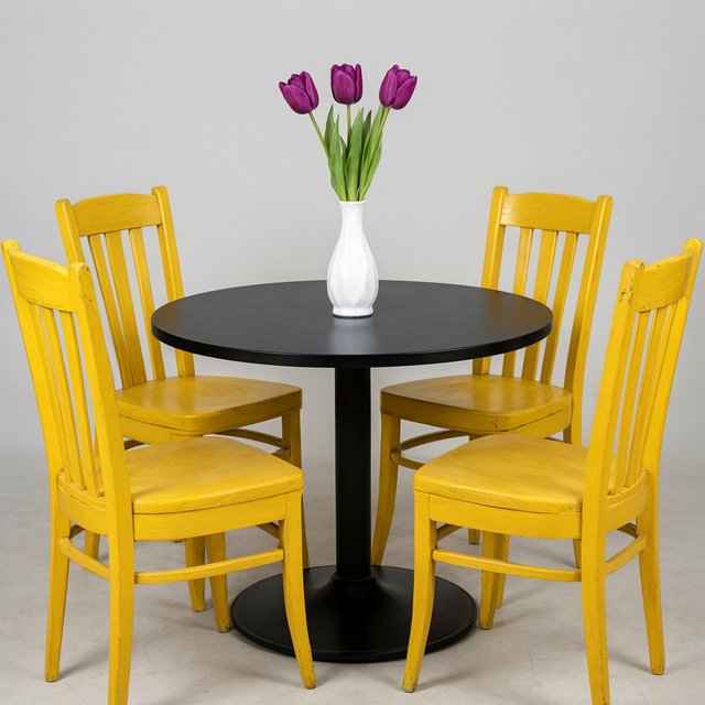Exactly four yellow wooden chairs surround a round black table: two chairs at the front, one on the left, and one on the right. A white vase with three purple tulips sits at the table center, nothing else. — Qwen Image 3.0 Pro