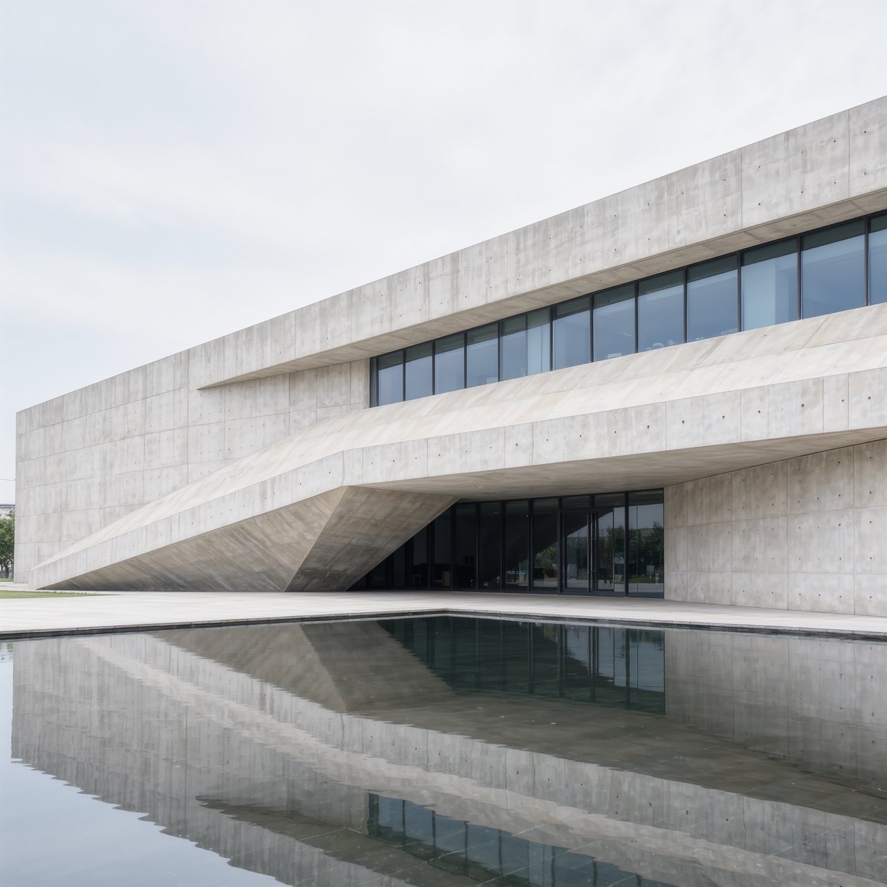 Exterior of a compact brutalist art museum, pale board-formed concrete, deep rectangular window recesses, a broad cantilevered entrance canopy, low reflecting pool, overcast afternoon light, viewed from a quiet plaza at eye level, crisp orthogonal architectural photography. — Kling v3 Omni