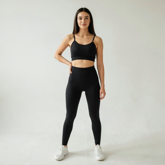 A pretty, slim woman with wide hips, wearing gym wear. Full-body image. Plain background. — Ideogram v4.5