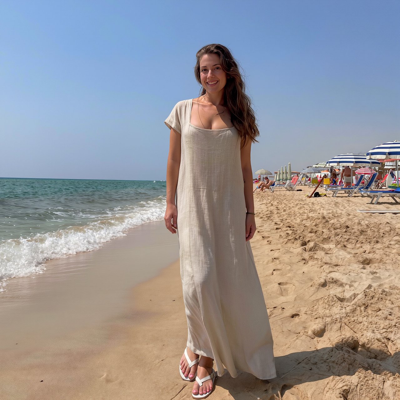 Authentic amateur photo of a beautiful adult woman standing at an Italian beach during vacation time. She wears appropriate clothing. It is noon. — Kling v3