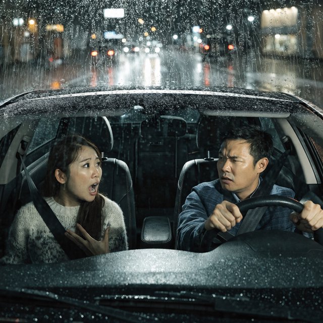 Frontal cinematic shot through the windshield of a car driving at night. A 35-year-old Chinese man is in the driver’s seat, gripping the steering wheel and arguing back in visible frustration. Beside him, a 30-year-old Chinese woman in the front passenger seat is nagging him animatedly, gesturing as she speaks. Both are clearly engaged in a tense argument. Nighttime city lights and passing streetlights glow outside, with reflections across the windshield and realistic interior lighting. — Recraft v4 Pro