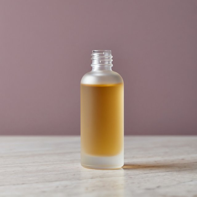 Under a broad diffused key and cool edge light, an unbranded frosted-glass serum bottle displays clear golden oil against a muted plum background, resting on honed pale travertine with its blank surface free of lettering. — ImagineArt 2