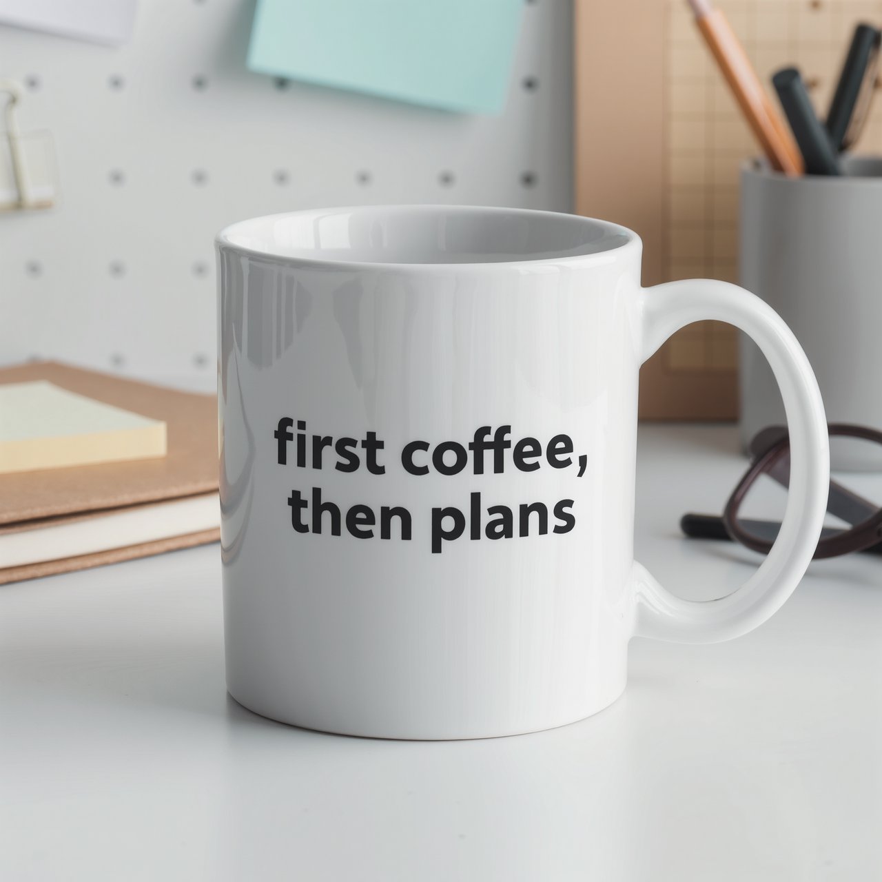 A white ceramic mug on a desk with the words "first coffee, then plans" printed in black lowercase sans-serif. — Kling v3 Omni