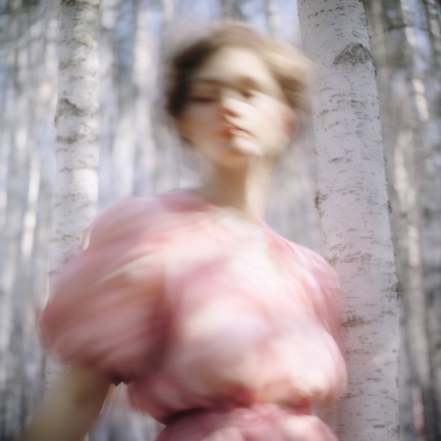 Create an adult odalisque entirely made of anthologies. The odalisque is formed from an anthology, with movement and motion blur that clearly shows its composition. The material should appear high quality, with dappled sunlight. The background is a birch forest, and the overall mood is Futurism. — Krea 2 Large