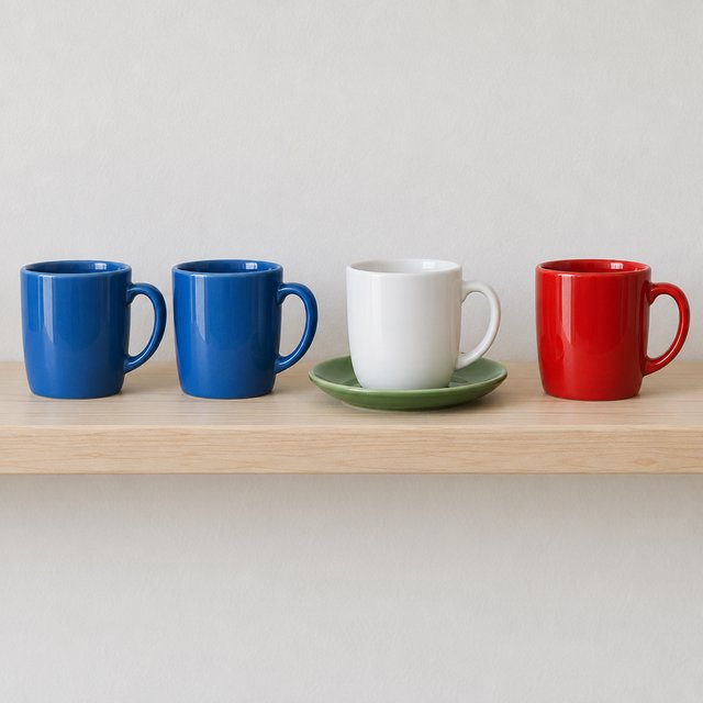 Exactly four ceramic mugs sit on a pale wooden shelf: two blue mugs on the left, one white mug in the center, and one red mug on the right. A green saucer is beneath the center mug, nothing else. — GPT Image 2.5 Flare