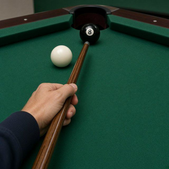 First-person perspective of an adult pool player’s left hand holding the cue, aiming the white cue ball at the black 8-ball and intending to pocket it in the center pocket. — Grok Imagine Image 2