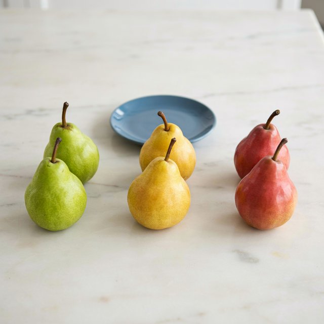 Exactly six ripe pears sit on a pale stone counter: two green pears on the left, two yellow pears in the center, and two red pears on the right. A small blue plate sits above the center pair, nothing else. — Ideogram v4.5