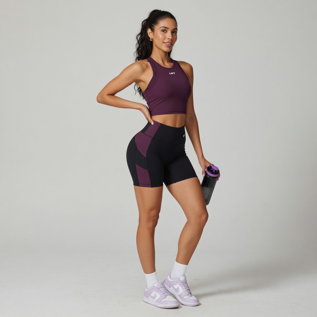 A pretty, slim woman with wide hips, wearing gym wear. Full-body image. Plain background. — Grok Imagine Image Quality