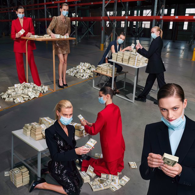 Adult women wearing masks (the kind you wear when you have a cold), in a warehouse, all wearing the kinds of outfits you would see models wear on a runway, counting lots of money (money is seen everywhere, on tables, on the floor, etc.). At least 4 different POVs. — Kling v3