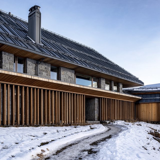 Exterior of a contemporary alpine research lodge in restrained regional modernism, rough granite walls, larch screens, steep standing-seam roof, crisp snow-bright morning light, viewed from below across a mountain footpath, sound structural geometry. — Krea 2 Large