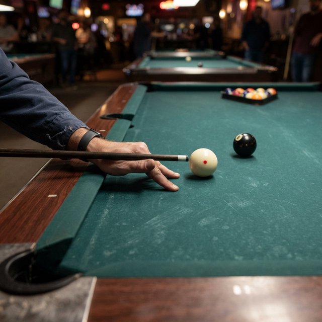 First-person perspective of an adult pool player’s left hand holding the cue, aiming the white cue ball at the black 8-ball and intending to pocket it in the center pocket. — Nano Banana 2 Lite