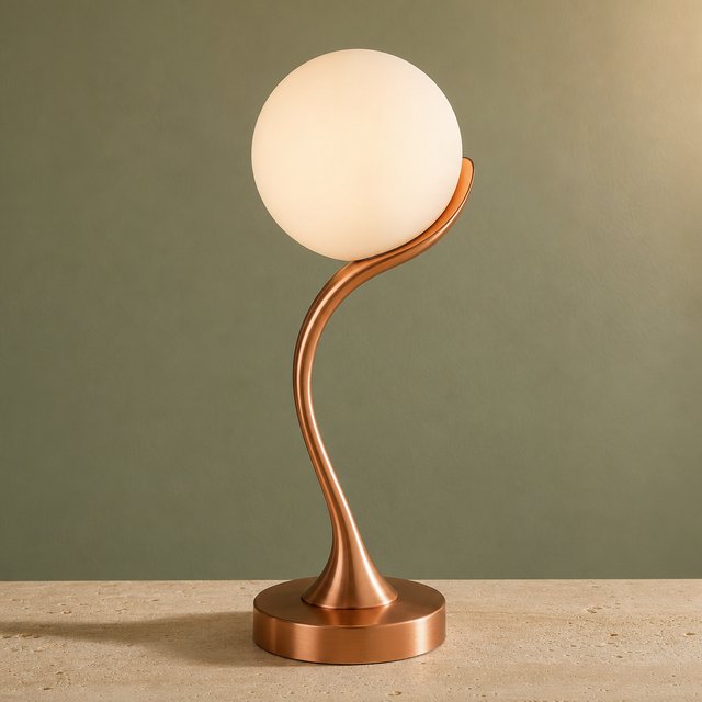 Commercial product photograph of an unbranded sculptural desk lamp with a frosted opal glass globe and brushed copper stem, standing on a pale travertine surface against a muted sage background, illuminated by soft overhead diffusion and a delicate warm rim light. — GPT Image 2
