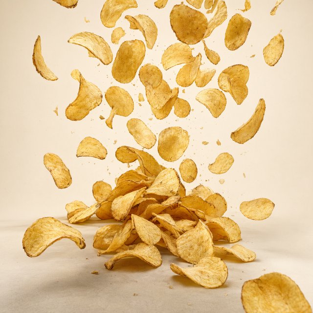 A creative promotional poster for potato chips featuring a forced perspective effect. — Qwen Image 3.0 Pro