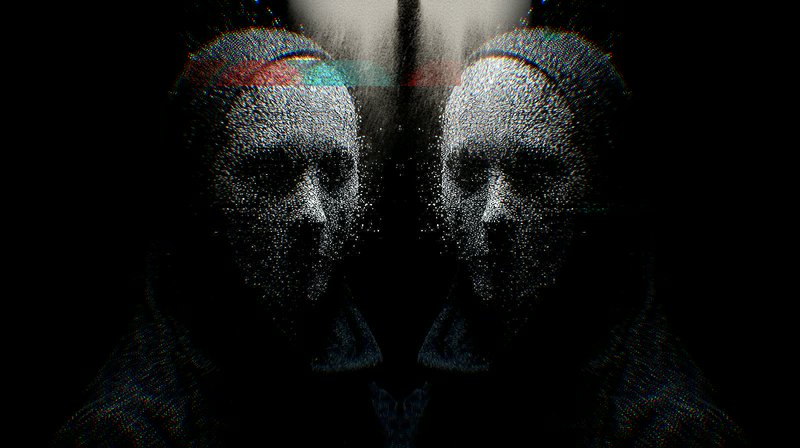 Glitch-art mirrored portrait with pixelated specks and color distortions on a dark background.