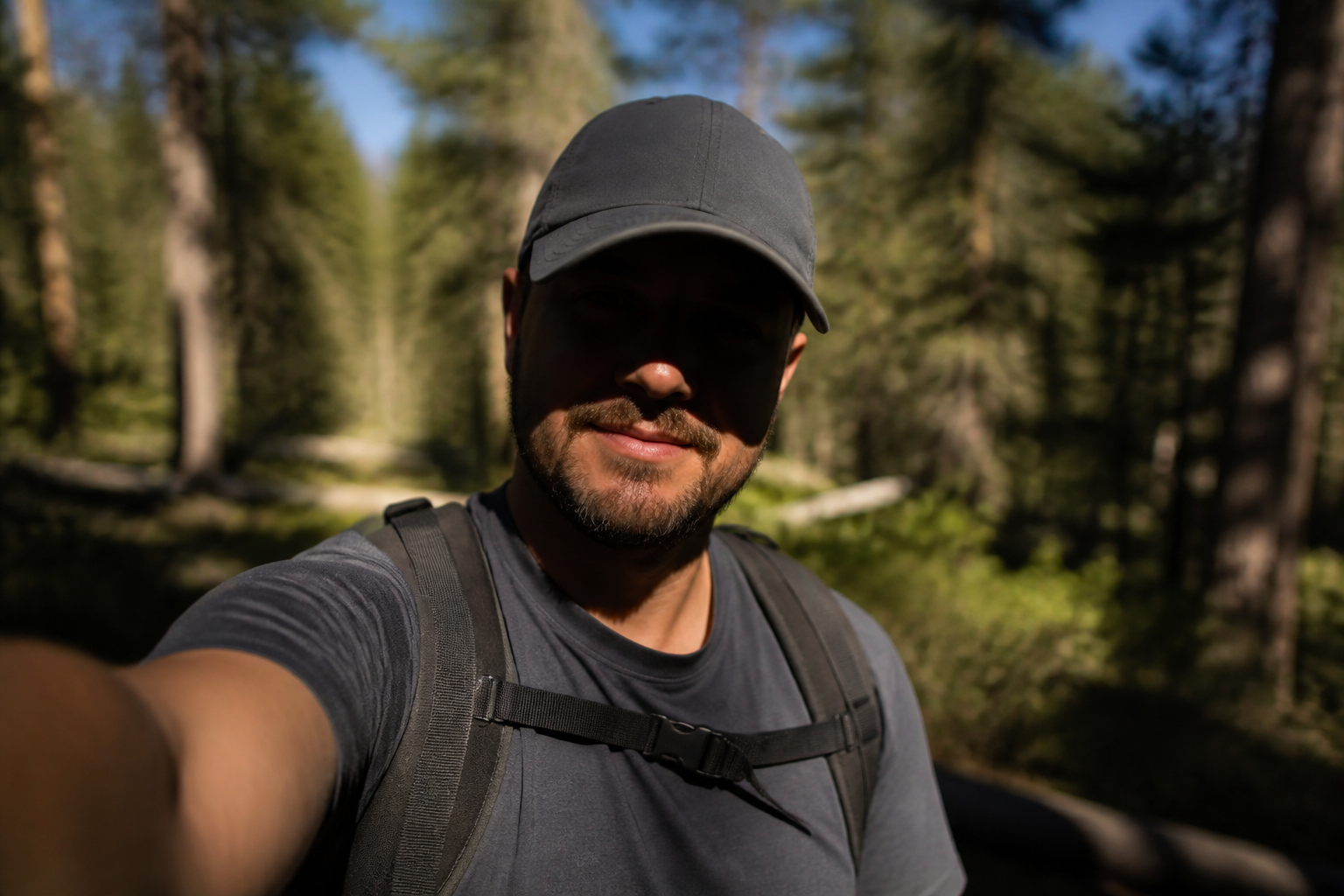 Blurry hiking selfie → clear trail portrait (before)