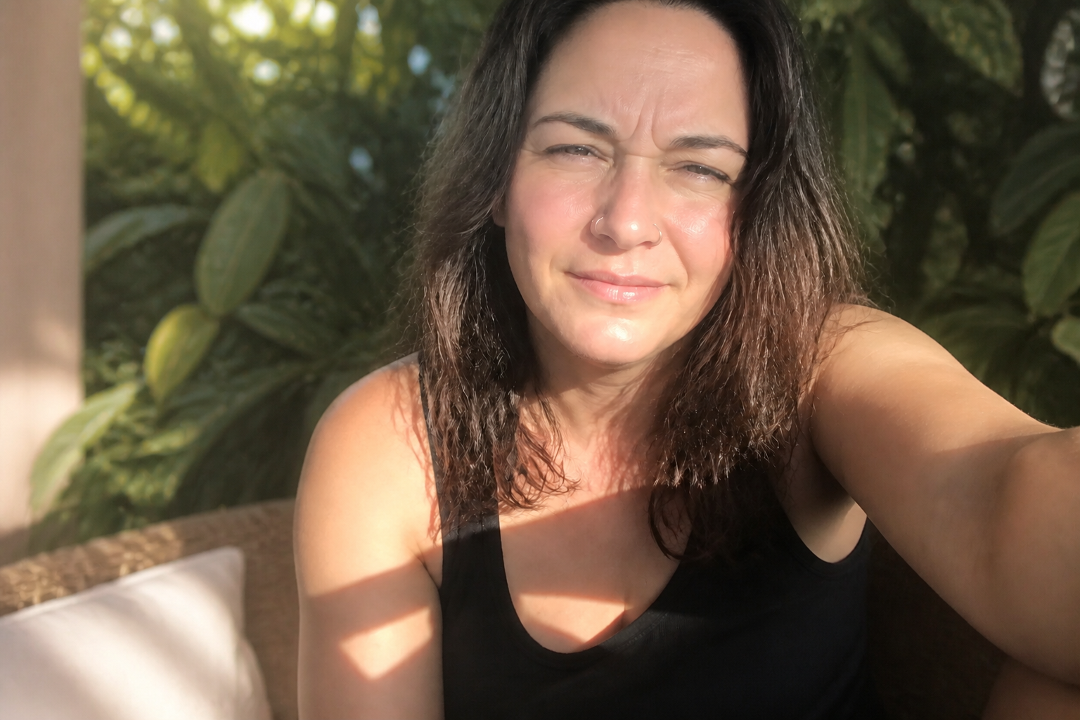 Glary car selfie → shaded patio portrait (after)