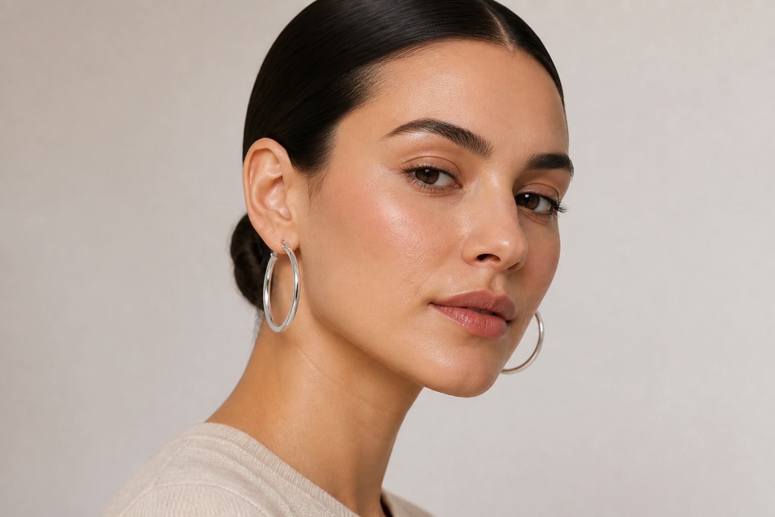 Silver hoops on portrait model (after)