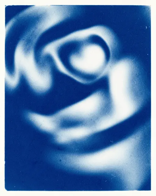 Soft blurred swirling abstract shapes in deep prussian blue and bright white cyanotype print style