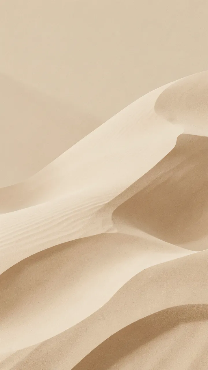 Vertical minimalist composition of soft layered sand dunes in warm beige and caramel tones