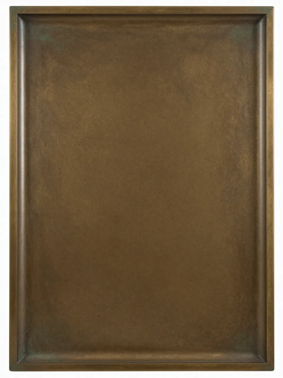Full frame close-up of a raised rectangular antique bronze surface with mottled brown and green patina