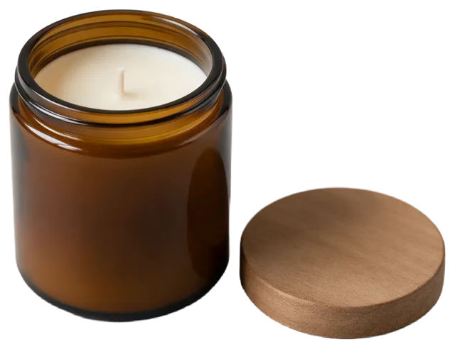 Unlit hand-poured soy candle in an amber glass jar with its wooden lid set beside it