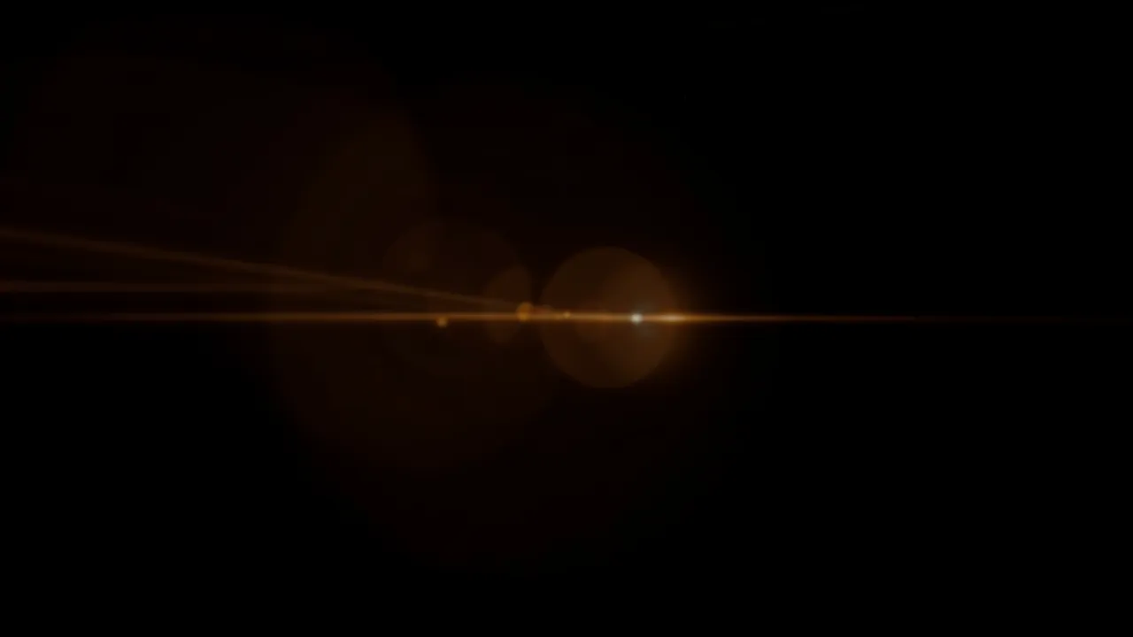 Subtle amber lens flare with horizontal streaks and round bokeh orbs on a solid pure black background