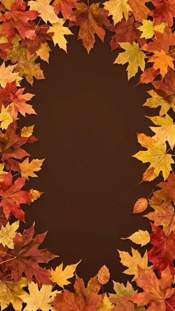 Rust and gold autumn maple leaves form a vertical border around an empty deep brown center