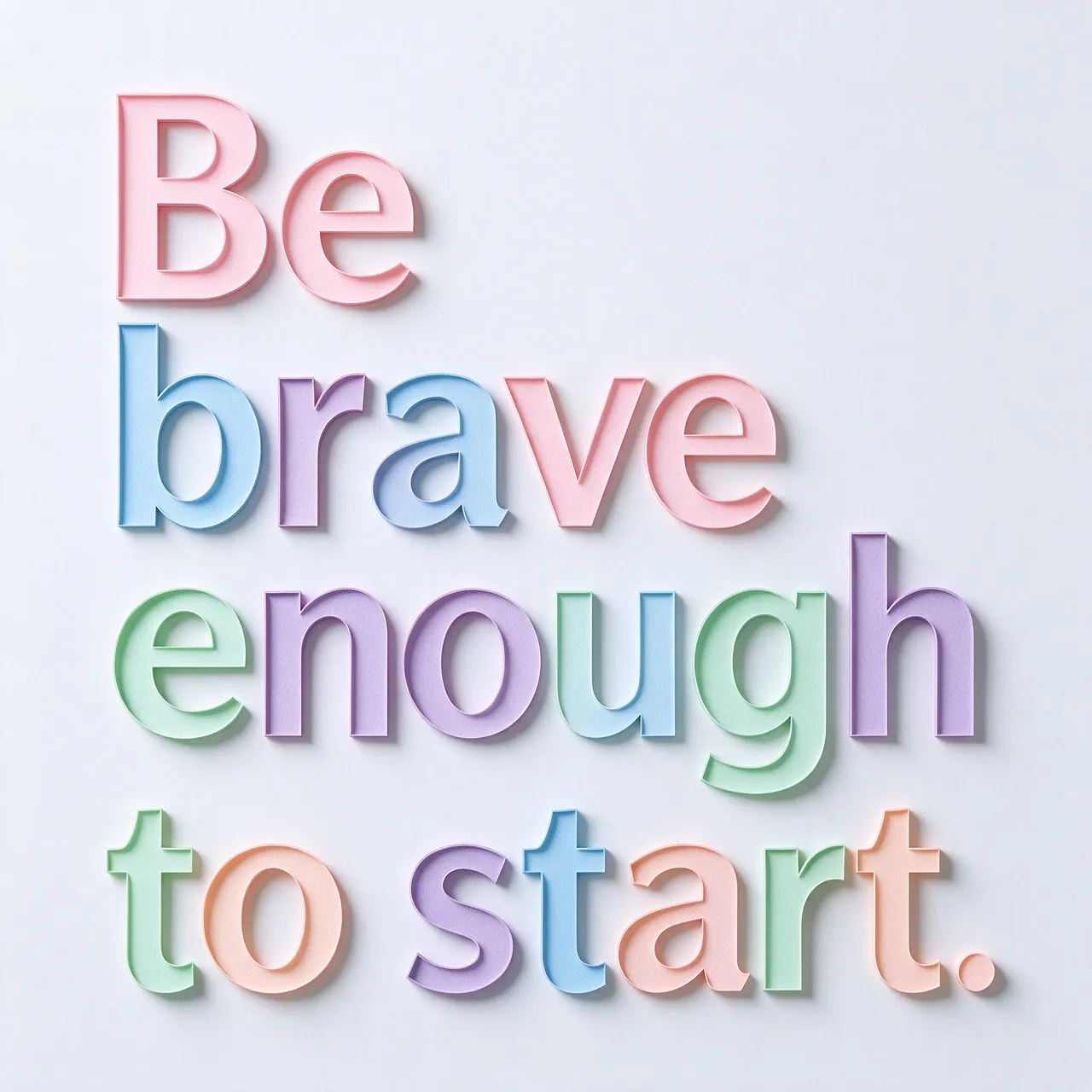 Layered pastel paper cut-out lettering spelling "Be brave enough to start." casts soft shadows on a pale background.