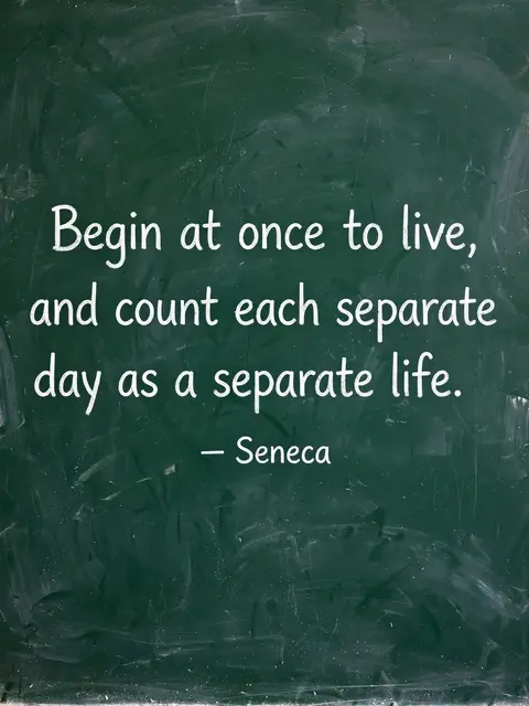 White chalk lettering of the quote "Begin at once to live, and count each separate day as a separate life." on a worn green
