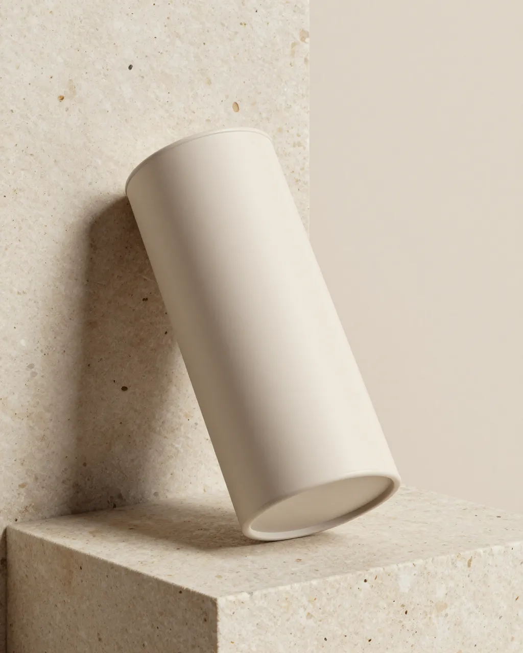 A plain soft beige cylindrical container rests on a textured travertine stone block against a neutral beige background