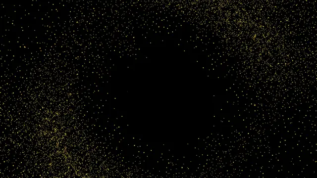 Fine scattered gold dust like distant stars rests on a solid black background with a central empty copy space area