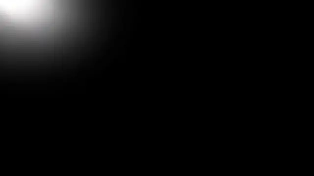 Nearly full black background with a soft, faint silver light leak gradient in the top left corner