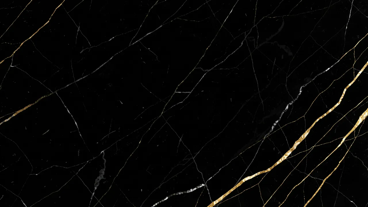 Polished black marble surface with thin irregular gold and pale veining across a dark base with empty copy space