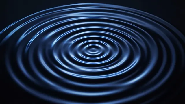 Glowing concentric blue ripples spread outward across a dark still surface against a black background