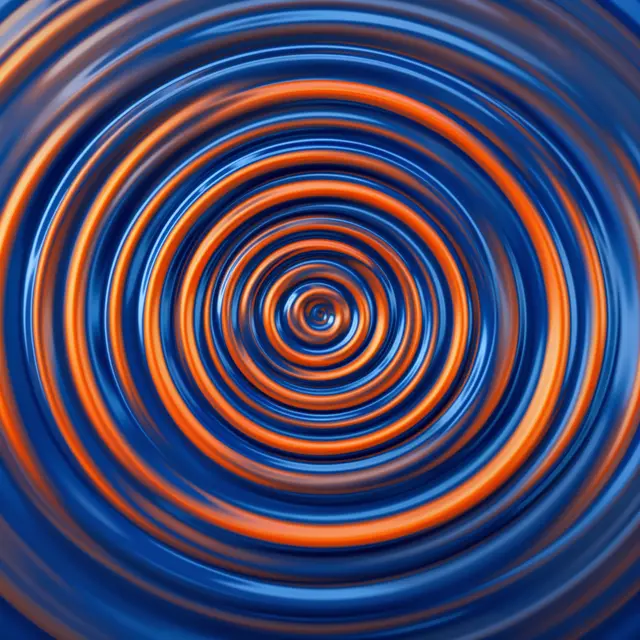 Glossy concentric spiral ripples alternate between deep blue and warm orange tones