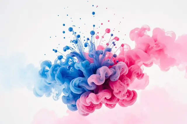 Swirling blue and pink ink disperses into delicate cloud-like blooms against a pale white background