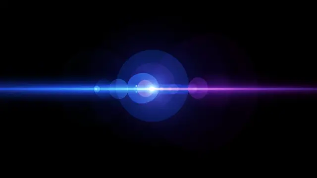 Horizontal blue to purple lens flare streak with ghost circles on a solid black background