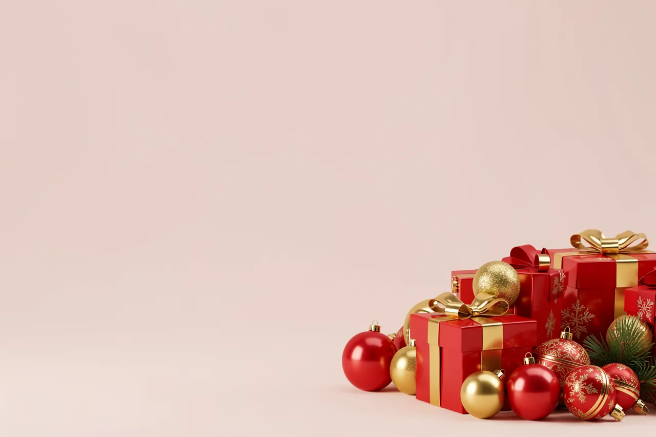 Clustered red and gold Christmas gifts and baubles sit at the lower right of an empty soft blush background