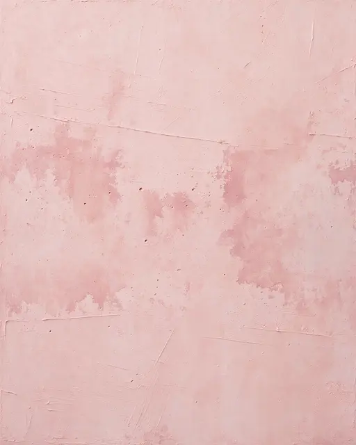 Full frame close-up of blush pink skim coat plaster with visible trowel sweeps and darker drying patches under flat lighting