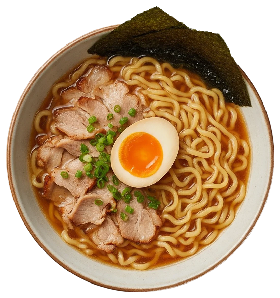 Top down view of a bowl of ramen topped with pork, soft egg, spring onions and nori