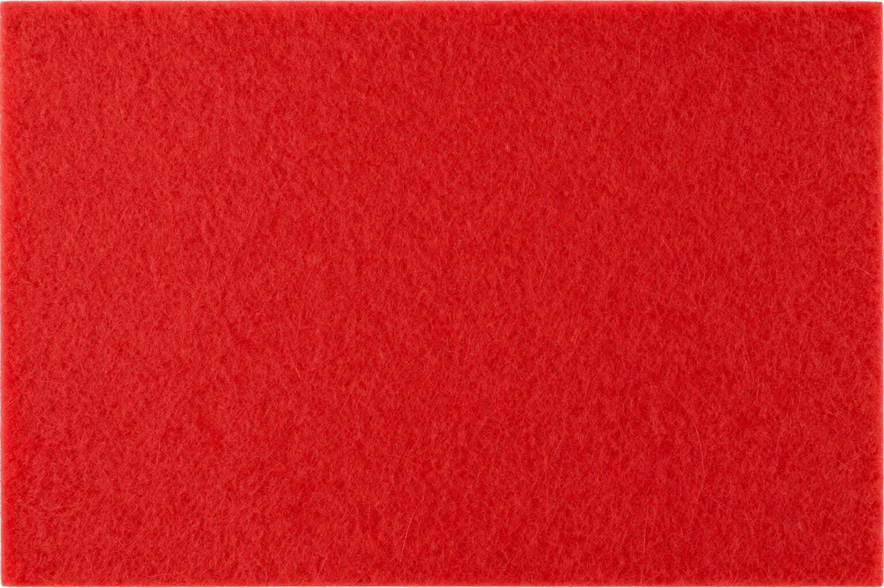Full frame close-up of bright red fuzzy fibrous craft felt with even flat lighting