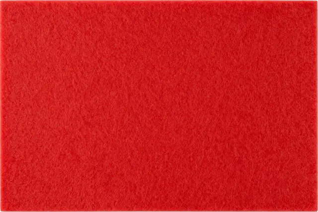 Full frame close-up of bright red fuzzy fibrous craft felt with even flat lighting