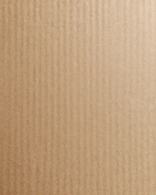 Close-up full frame of textured brown kraft cardboard with fine vertical ridges in even flat lighting