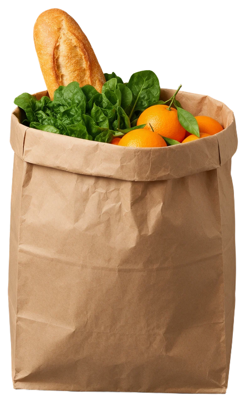 A brown paper grocery bag holds a baguette, leafy greens and fresh oranges.