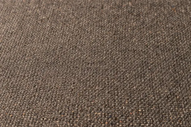 Close-up full frame of woven brown tweed fabric with scattered fine multicolored flecks