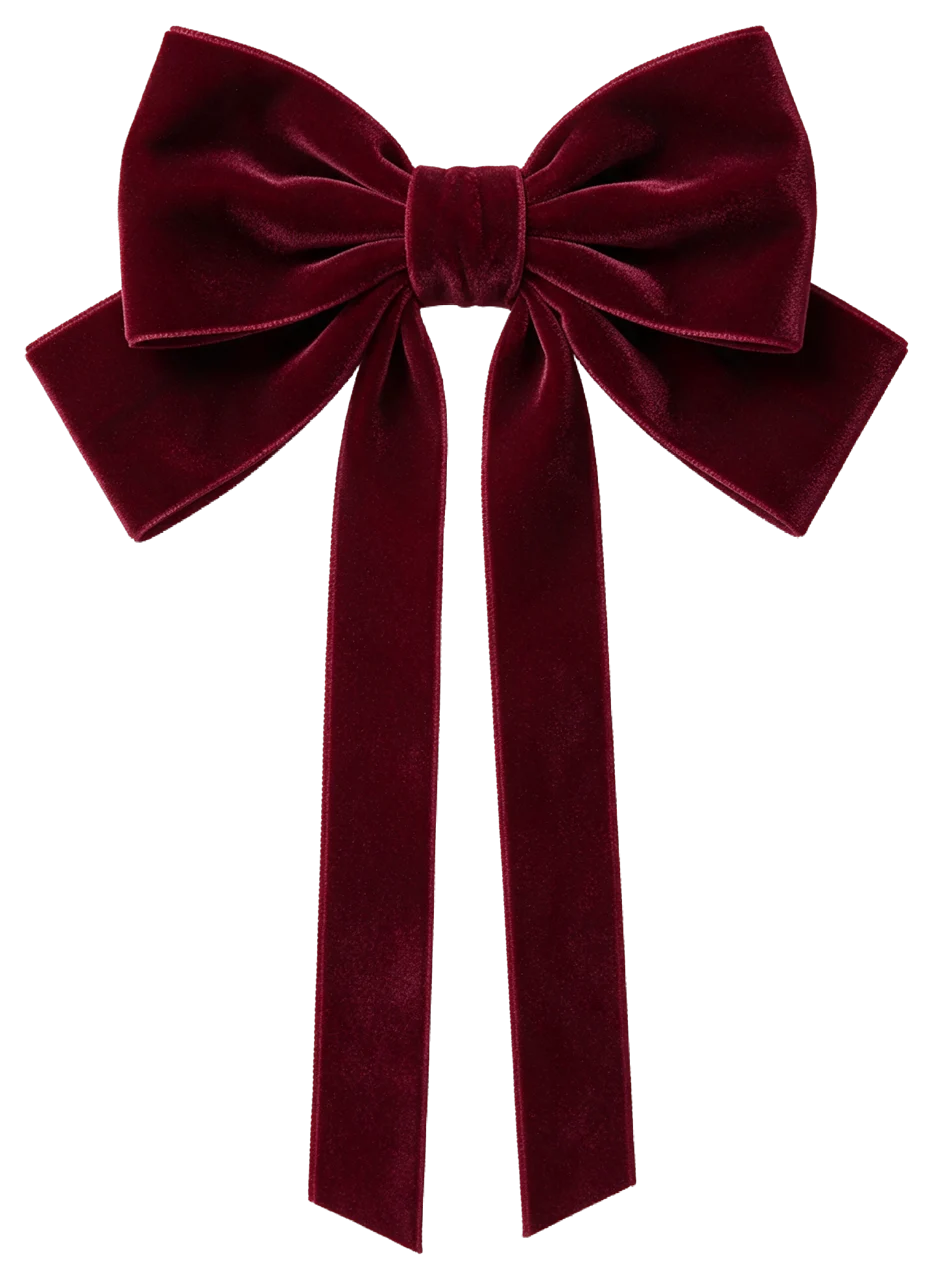 A large symmetrical hand-tied deep burgundy velvet bow with long hanging tails